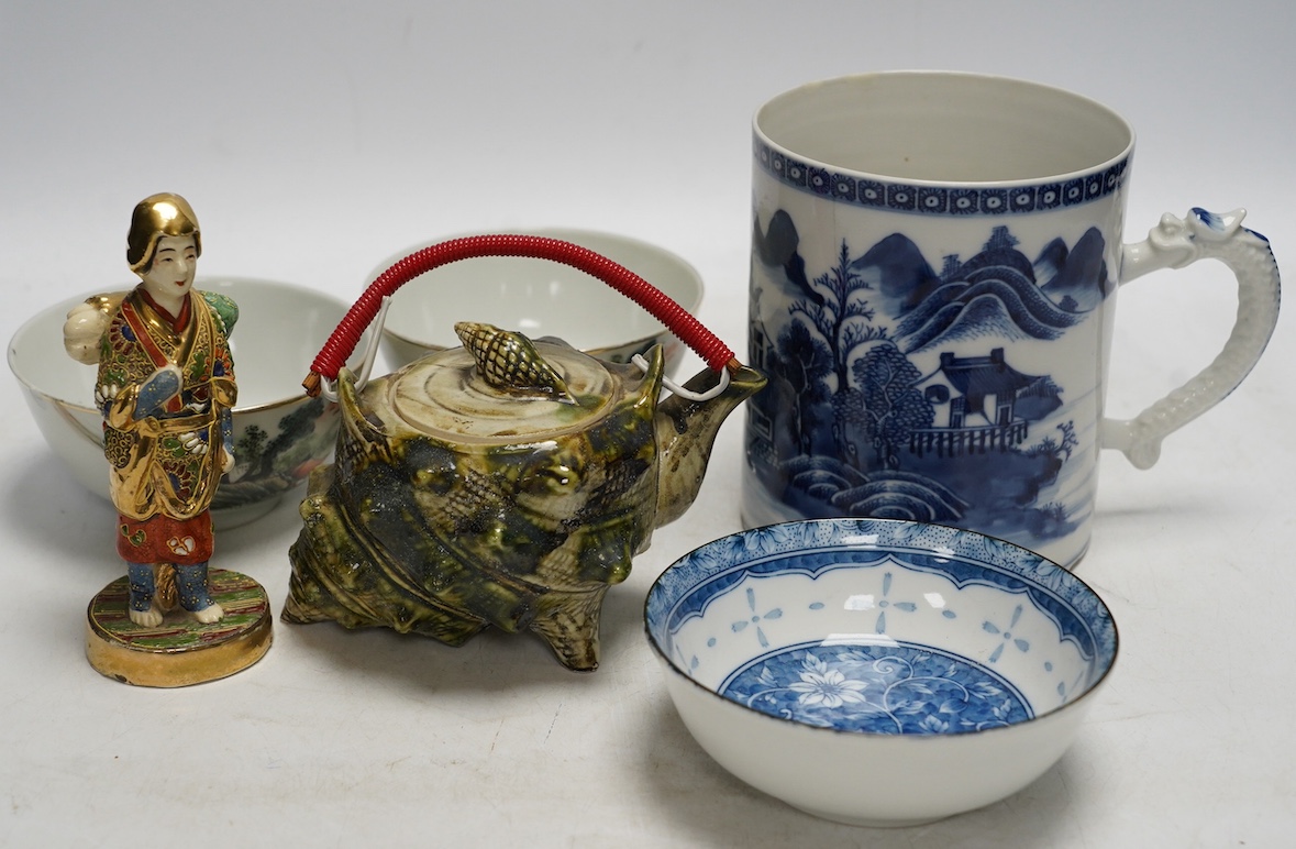 A collection of Chinese and Japanese ceramics to include tea bowls, a blue and white mug and teapot in the form of a shell, largest 13cm high. Condition - mostly good